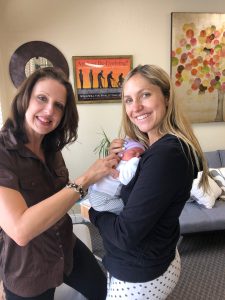 Mom and newborn– excited to get first adjustment post-birth!
